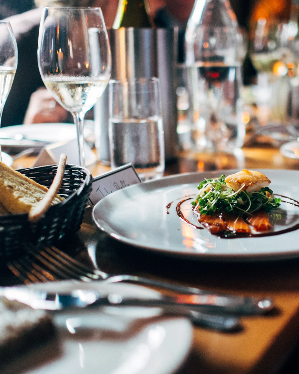 A plated dish at a candlelit restaurant table